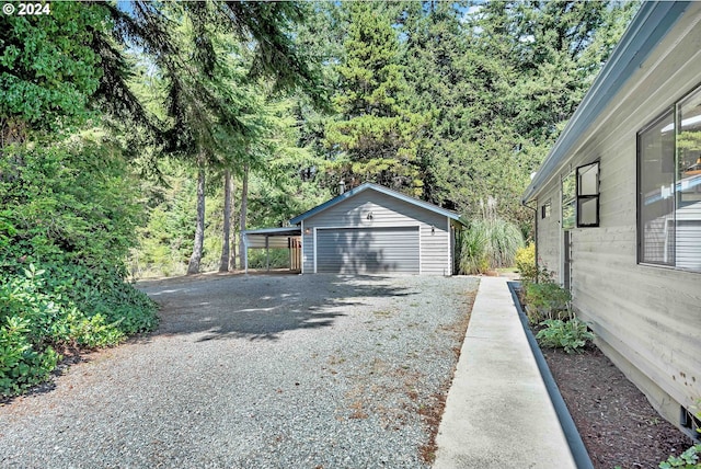 garage featuring a carport