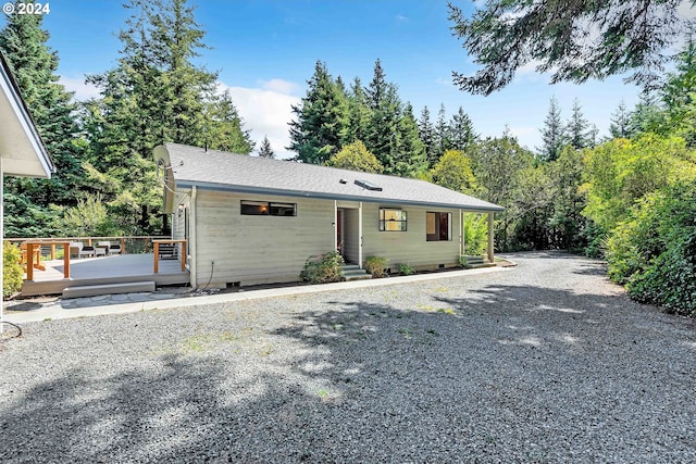 single story home featuring a deck