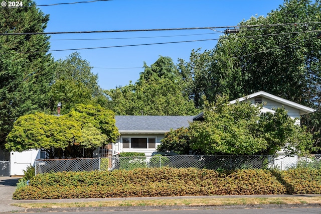 view of property hidden behind natural elements