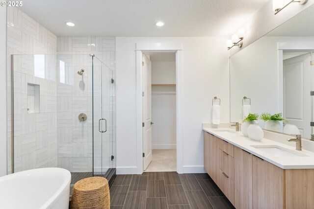 kitchen featuring sink, stainless steel appliances, white cabinets, and pendant lighting