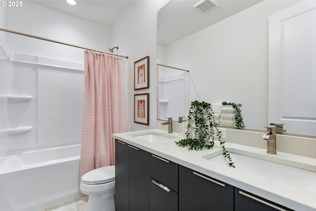 full bathroom with tile patterned flooring, vanity, toilet, and shower / bath combo with shower curtain