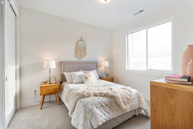 bedroom with light carpet