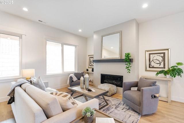 living room with light hardwood / wood-style flooring