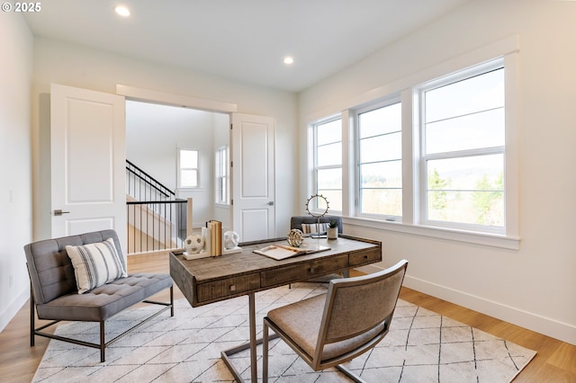 office area featuring a wealth of natural light and light wood-type flooring