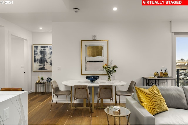 dining space with dark wood-type flooring