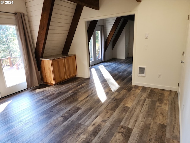 bonus room featuring french doors, dark hardwood / wood-style floors, lofted ceiling with beams, and wooden ceiling