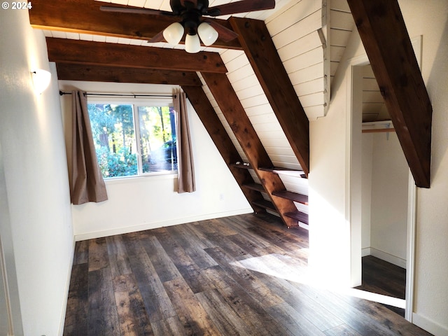 additional living space with vaulted ceiling with beams, wood ceiling, ceiling fan, and dark hardwood / wood-style flooring