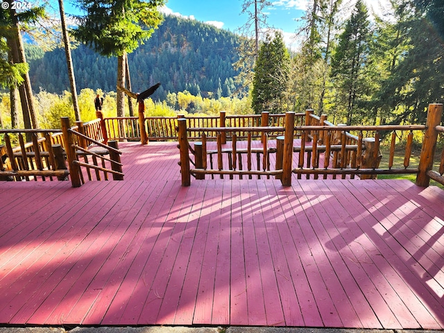 wooden terrace with a mountain view