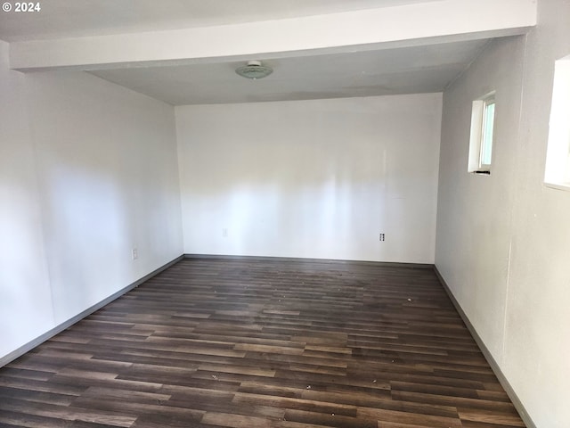 spare room featuring dark hardwood / wood-style floors