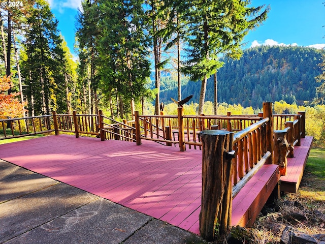 wooden deck with a mountain view