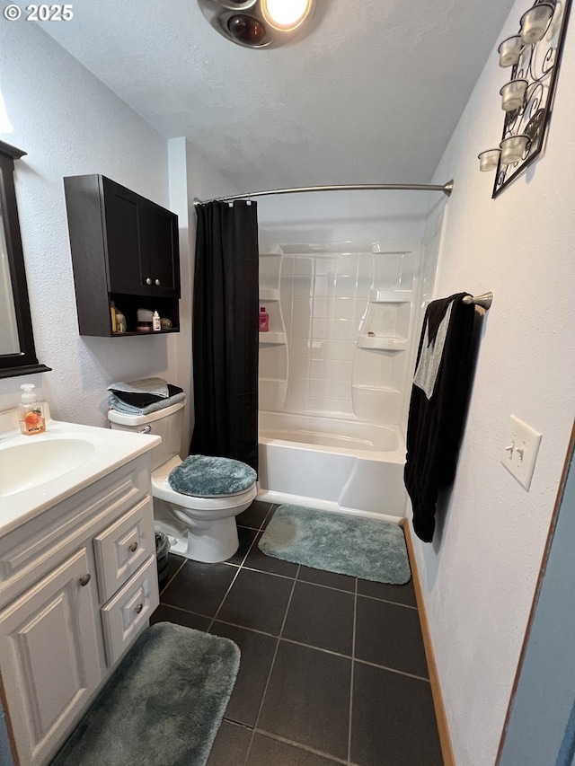 full bathroom with vanity, a textured ceiling, tile patterned floors, toilet, and shower / bath combo with shower curtain