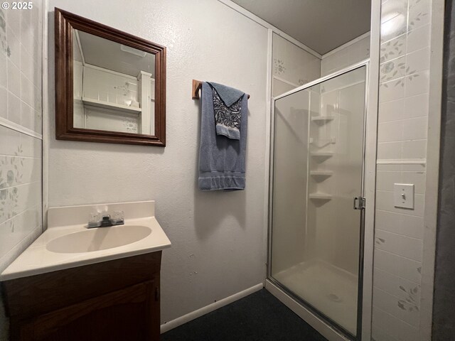 bathroom with vanity and an enclosed shower