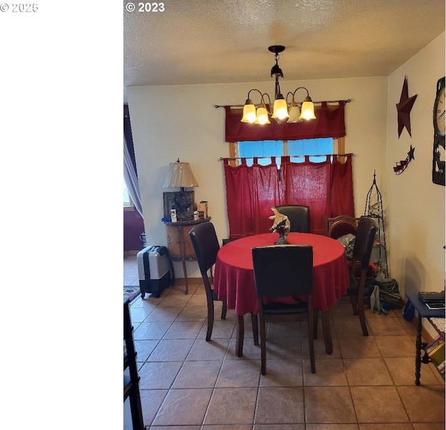 304 SE Hillcrest Dr, John Day, OR 97845 - tiled dining space featuring a chandelier and a textured ceiling