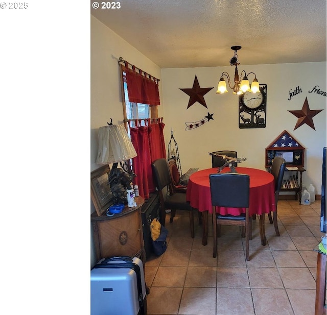 304 SE Hillcrest Dr, John Day, OR 97845 - tiled dining space with a chandelier and a textured ceiling