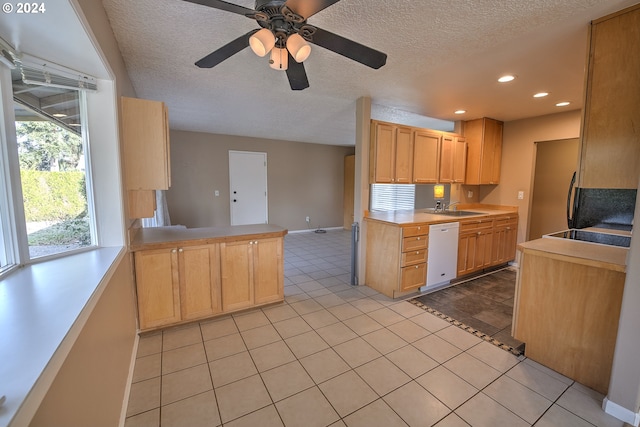 kitchen with light brown cabinets, white dishwasher, sink, ceiling fan, and kitchen peninsula