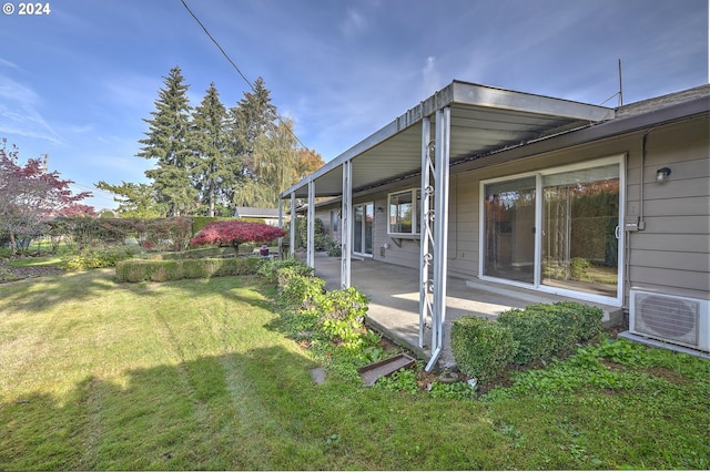 view of yard featuring ac unit and a patio