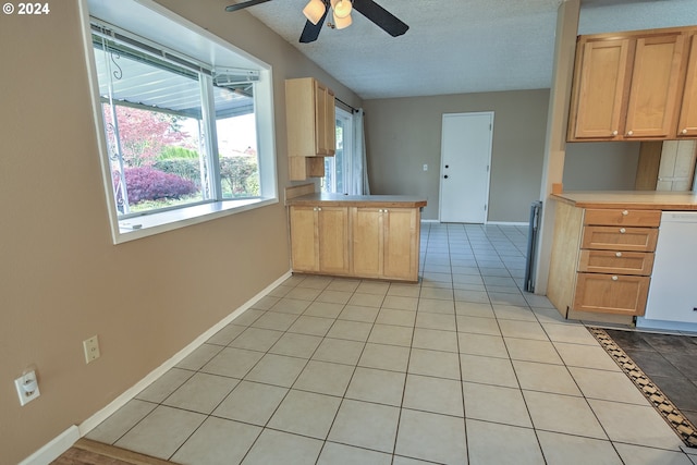 kitchen featuring kitchen peninsula, a textured ceiling, white dishwasher, ceiling fan, and light tile patterned floors