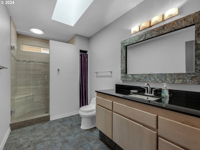 bathroom featuring curtained shower, vanity, toilet, and a skylight