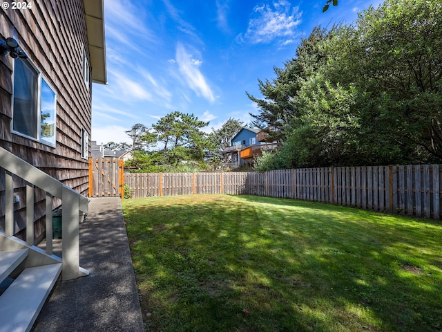 view of yard with a fenced backyard