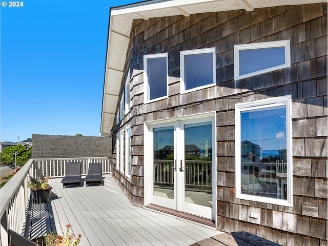 wooden deck featuring french doors