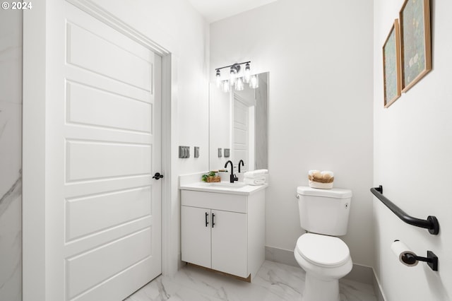 bathroom with toilet and vanity