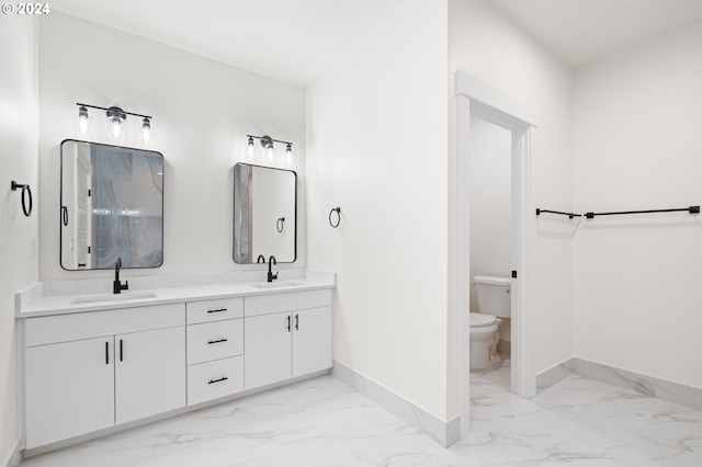 bathroom featuring toilet and vanity