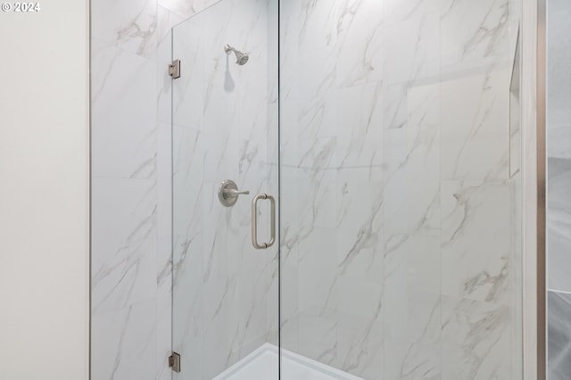 bathroom featuring an enclosed shower