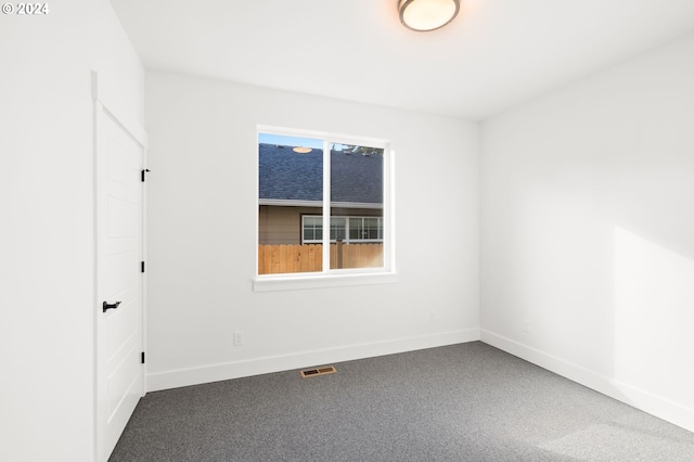 empty room with carpet flooring