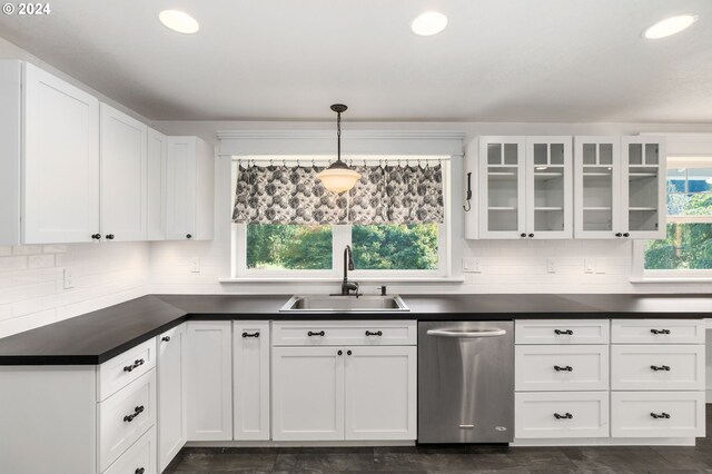 kitchen with dishwasher, decorative light fixtures, sink, and white cabinets