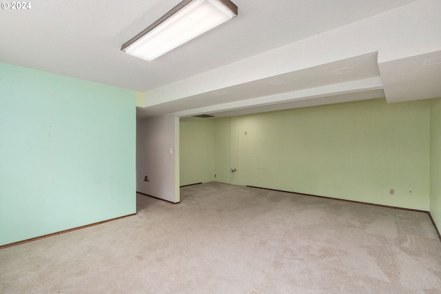 basement with light colored carpet