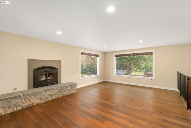 unfurnished living room with wood-type flooring