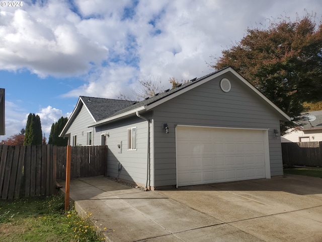 view of property exterior with a garage