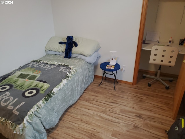 bedroom featuring light wood-type flooring