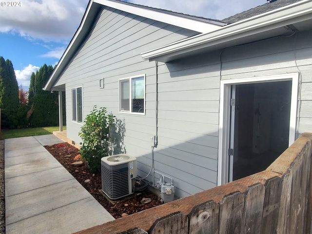 view of home's exterior with central AC