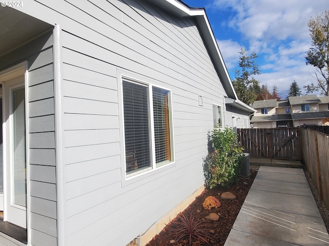 view of side of home featuring central air condition unit