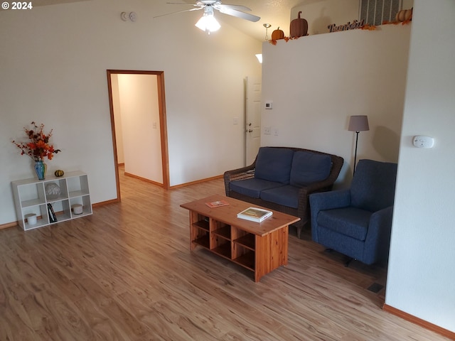 living room with vaulted ceiling, wood-type flooring, and ceiling fan