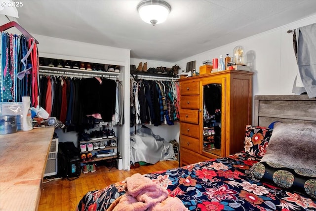 bedroom with hardwood / wood-style floors