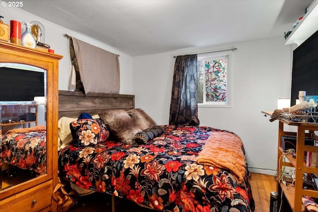 bedroom featuring hardwood / wood-style floors