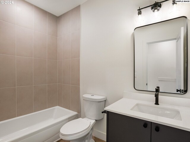 full bathroom with vanity, toilet, and tiled shower / bath