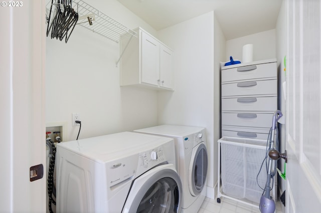 laundry area with cabinets and independent washer and dryer