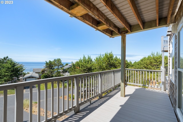 wooden deck featuring a water view