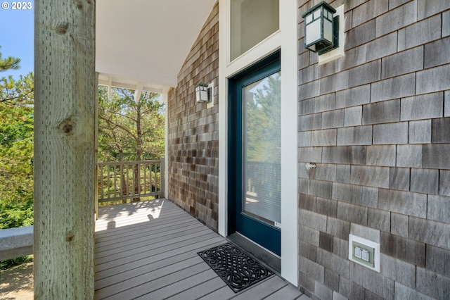 view of exterior entry featuring a porch