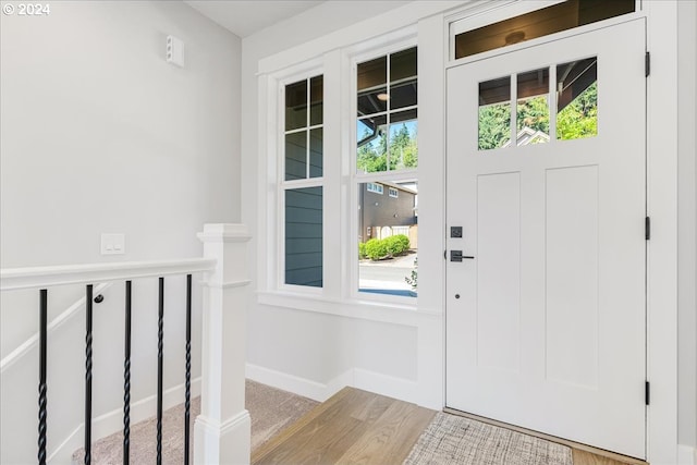 doorway to outside with light wood-type flooring