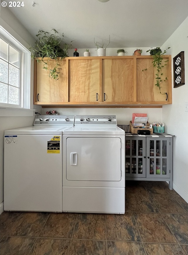 laundry area with cabinets and independent washer and dryer