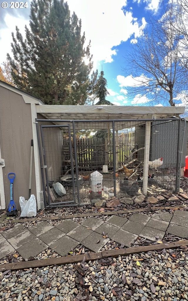 view of patio / terrace featuring an outbuilding