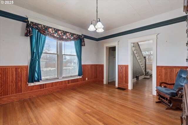 living room with a wood stove, high vaulted ceiling, wooden ceiling, and a skylight