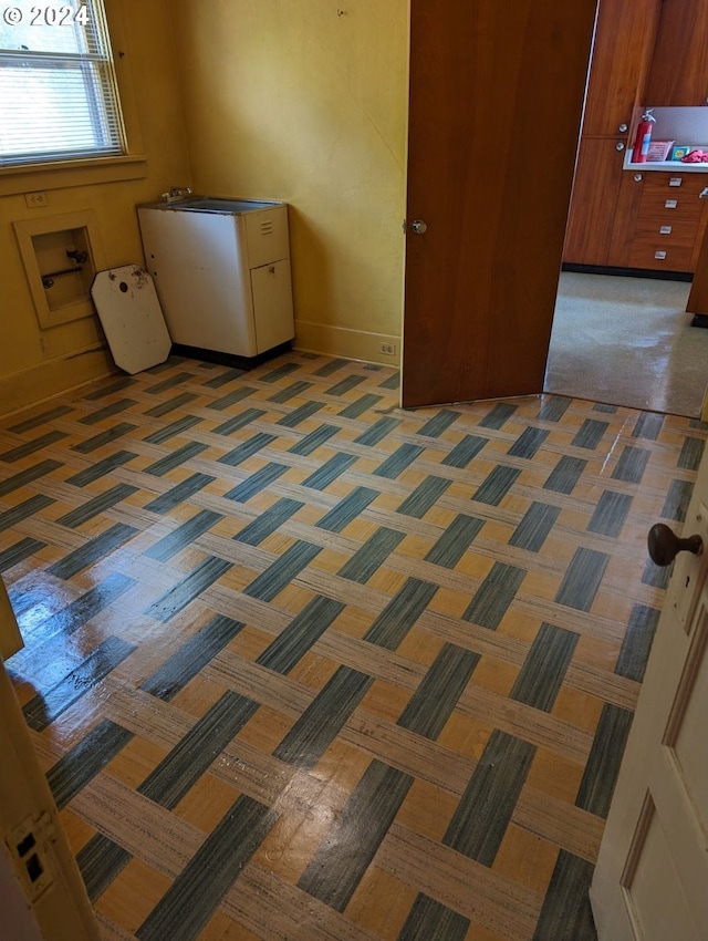 clothes washing area featuring hookup for a washing machine and dark colored carpet