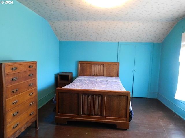 unfurnished bedroom with lofted ceiling