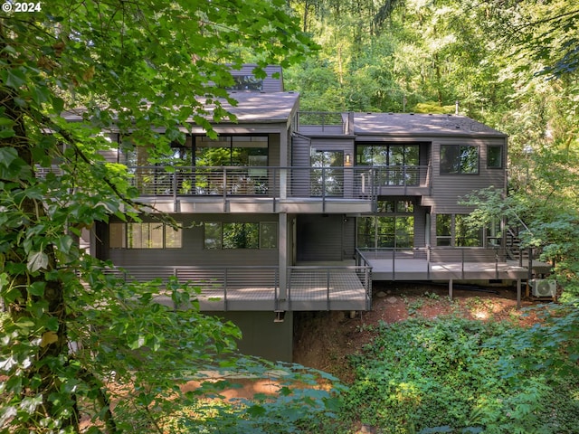 rear view of property with a wooden deck