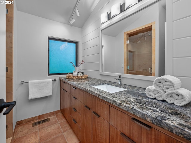 4731 SW 18th Dr, Portland, OR 97239 - bathroom with lofted ceiling, an enclosed shower, vanity, and track lighting